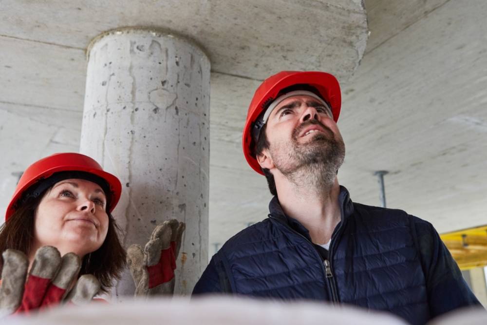 The architect and building surveyor find construction defects during an inspection on the construction site in the shell