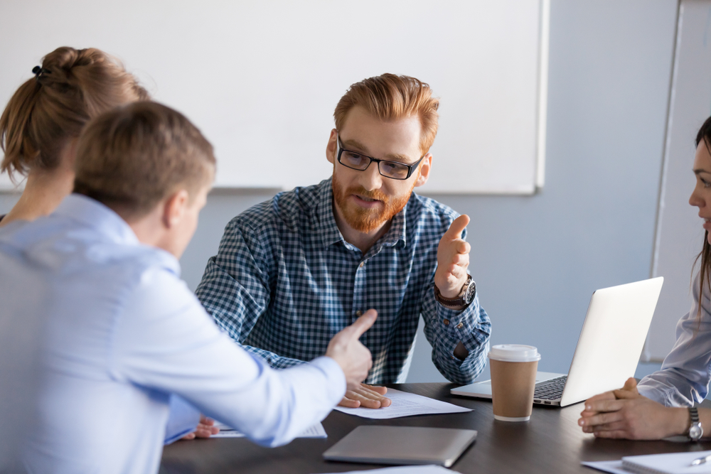Serious business men negotiating having discussion, dispute or disagreement at meeting or negotiations