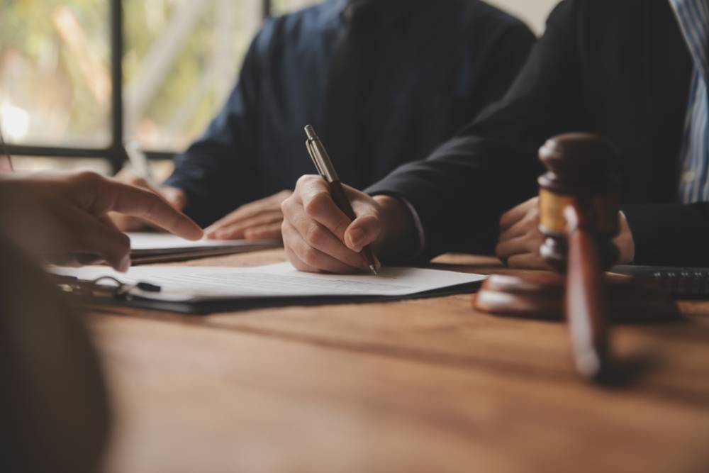 Consultation of Businesswoman and Male lawyer or judge counselor having team meeting with client, Law and Legal services