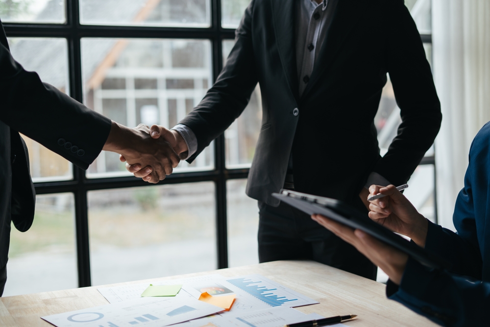 Business handshake for teamwork of business merger and acquisition,successful negotiate,hand shake,two businessman shake hand