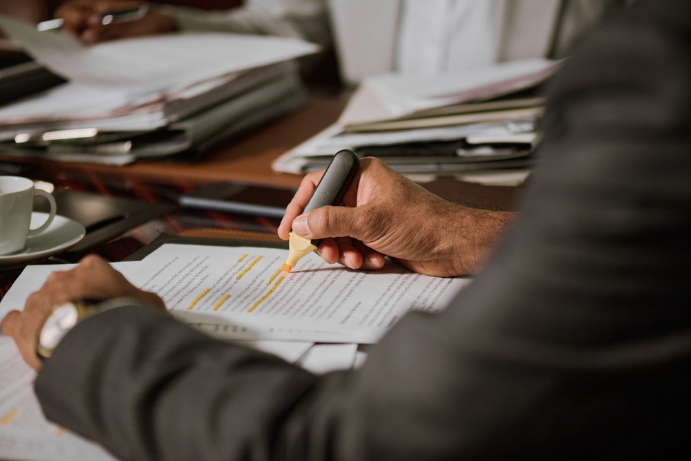 Focus on hand of experienced male lawyer